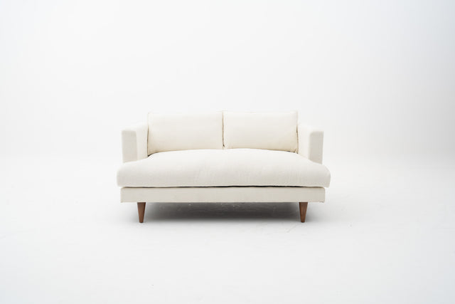 2-Seater white fabric sofa with wooden legs